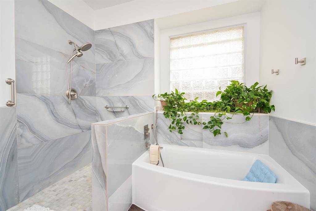 Choose your luxurious delight! A quick refreshing shower in this dreamy enclosure or a long, languishing soak in this inviting garden tub?