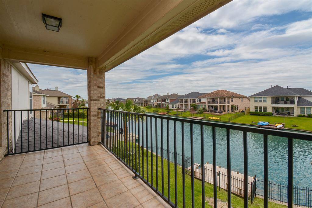 What a fresh, natural view from the 2nd floor balcony, overlooking your private boat dock!
