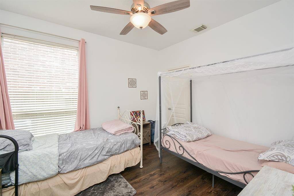 This secondary bedroom offers huge space for bedding options.