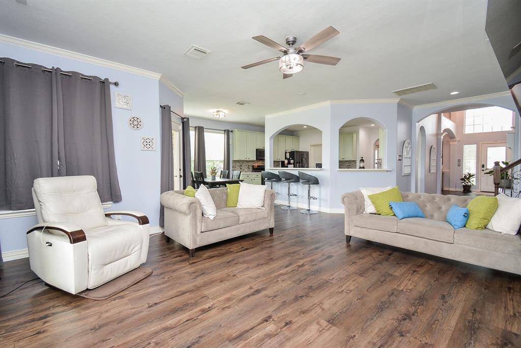 This blended living/dining area brings a kind of internal and external peace to any activities, here! The benefits and beauty of the open floor plan design concept are readily appreciated; with wide open, airy space, embracing common family/living areas.