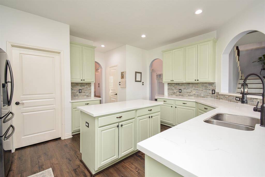 This bright chef's kitchen is a homemaker's dream! Everywhere you look, counter surfaces and generous storage, abound!