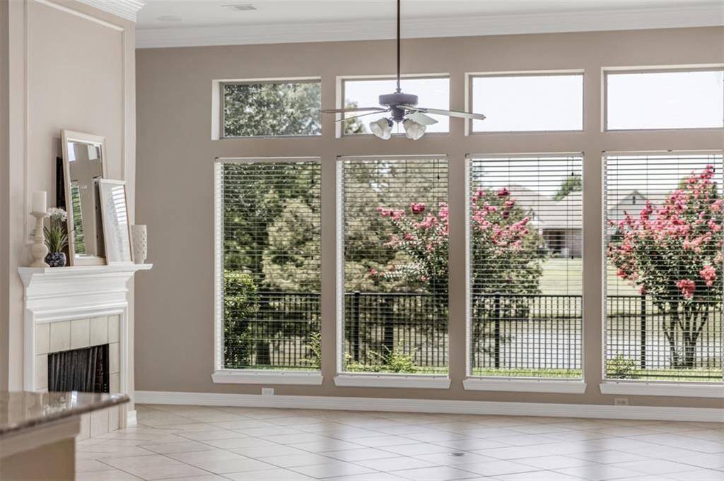 Lake view, anyone? The beautiful windows of the family room open up to this gorgeous sight, allowing you to enjoy the serene beauty of the lake right from the comfort of your own home.  With a northwest facing view, there is no worries about the afternoon sun dampening your lakeview enjoyment!