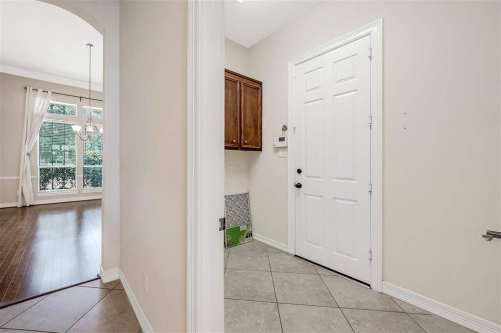 Conveniently located, the laundry room is just steps away, making laundry day a breeze.