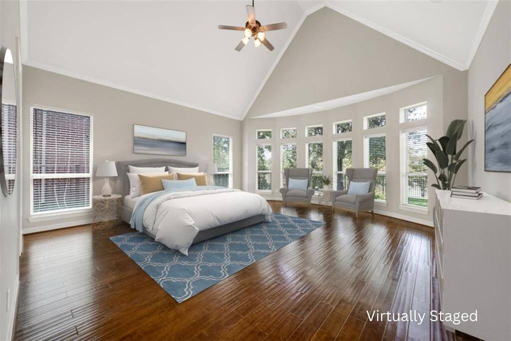 Welcome to your oversized primary suite, a spacious retreat within the home. This 20 x 21-foot space is zoned away from the other bedrooms, offering privacy from kids and guests. Enjoy plenty of natural light from the abundance of windows, each with automated blackout shades for added privacy and convenience. WOW, look at that lake again. A perfect sitting area to get comfy with a book and soak in the view!