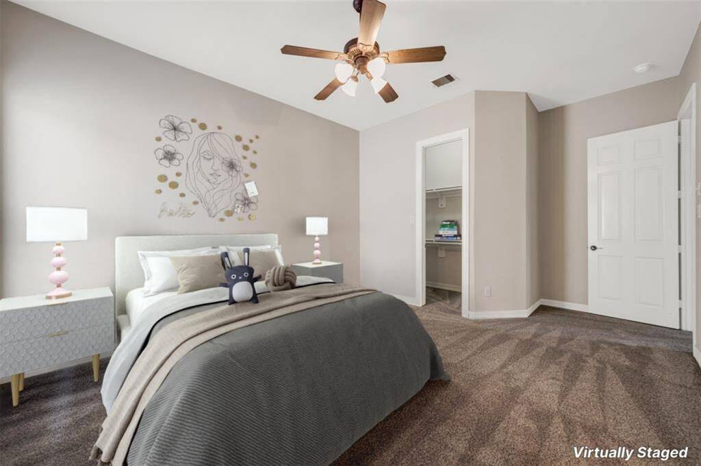 Welcome to the first of three secondary bedrooms, each featuring plush carpeting and ceiling fans for comfort. This 15x 14 room boasts an ensuite bathroom and is strategically located away from the other two bedrooms, offering privacy.