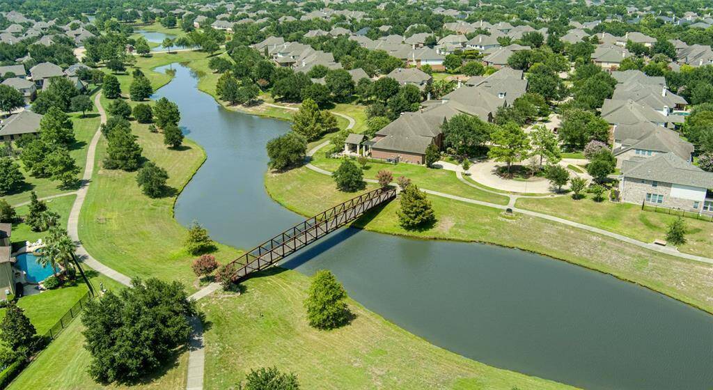 Another aerial showing the bridge to cross walking paths and extend your excursion.  In addition to walking trails, you are 1/2 mile away from mountain bike trails that run along Cypress Creek.  This truly is the ultimate in Master Planned Communities!