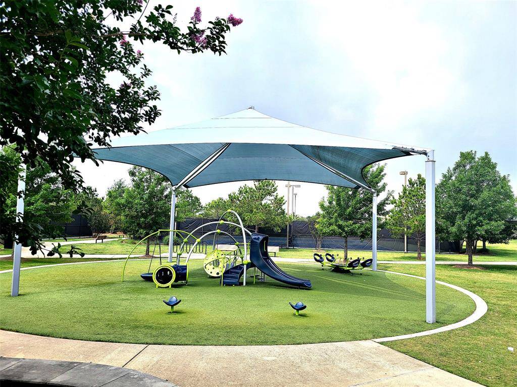 Lakeland Village Park covered playground.   Designed with those hot sunny days in mind to give some shade.