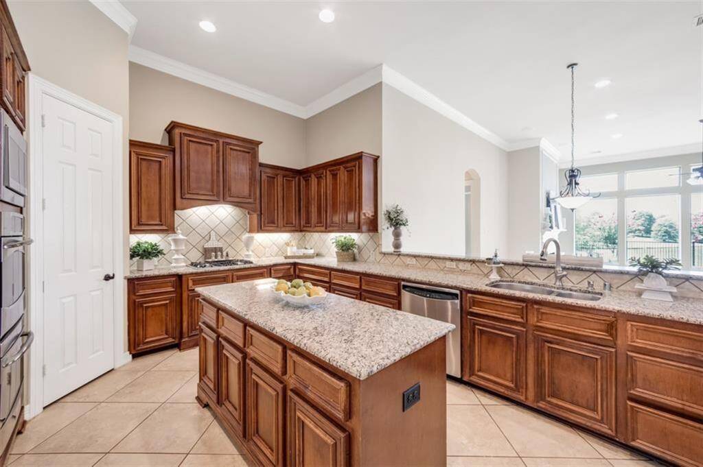 The kitchen island is the perfect spot for hosting impromptu gatherings with friends, just add a charcuterie board and let the good times roll! With plenty of cabinet space for all your cooking pans and ample counter space, preparing even the largest of meals in this kitchen is made easy.
