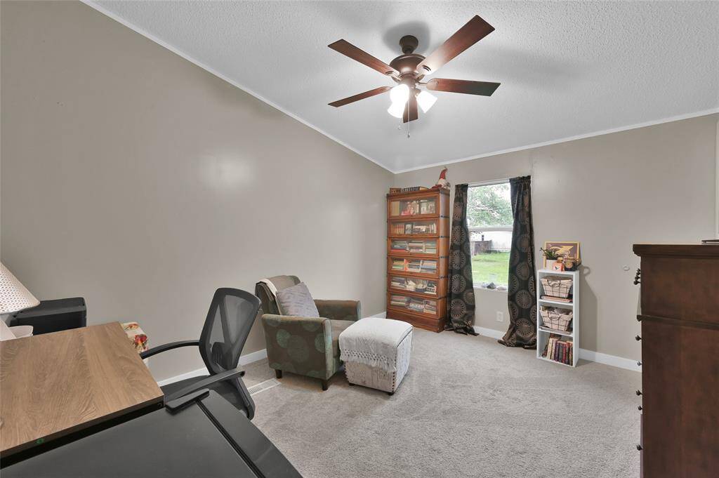 Secondary bedroom off of kitchen. Perfect for a guest room or home office.