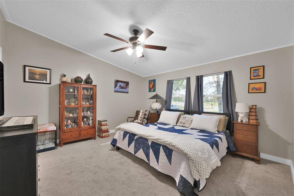 Primary bedroom with plenty of space for extra seating area if desired.