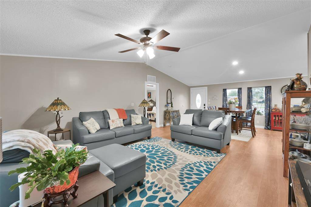 Another view of living room looking toward the entrance of home.
