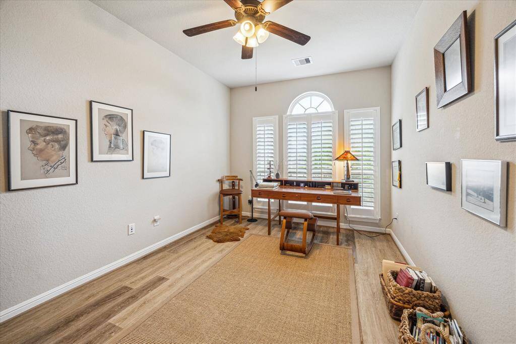 The office has set of triple windows, ceiling fan with light. Located at the front of the home and separate from other rooms makes the area very private and quiet.