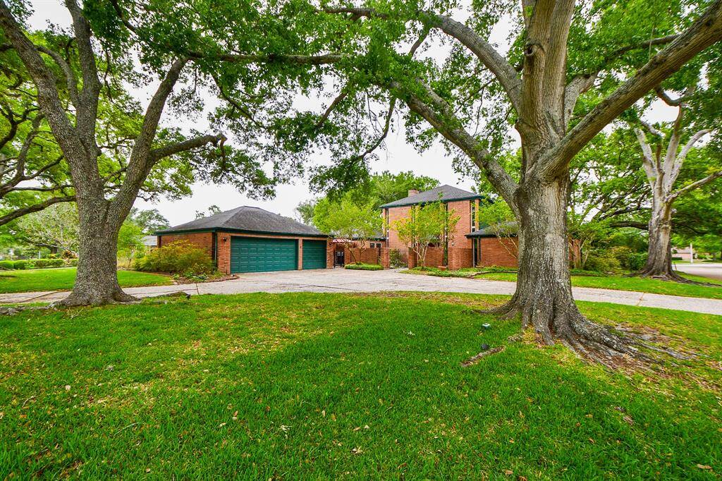 Stately home on gorgeous wooded lot. Circular driveway provides extra off street parking