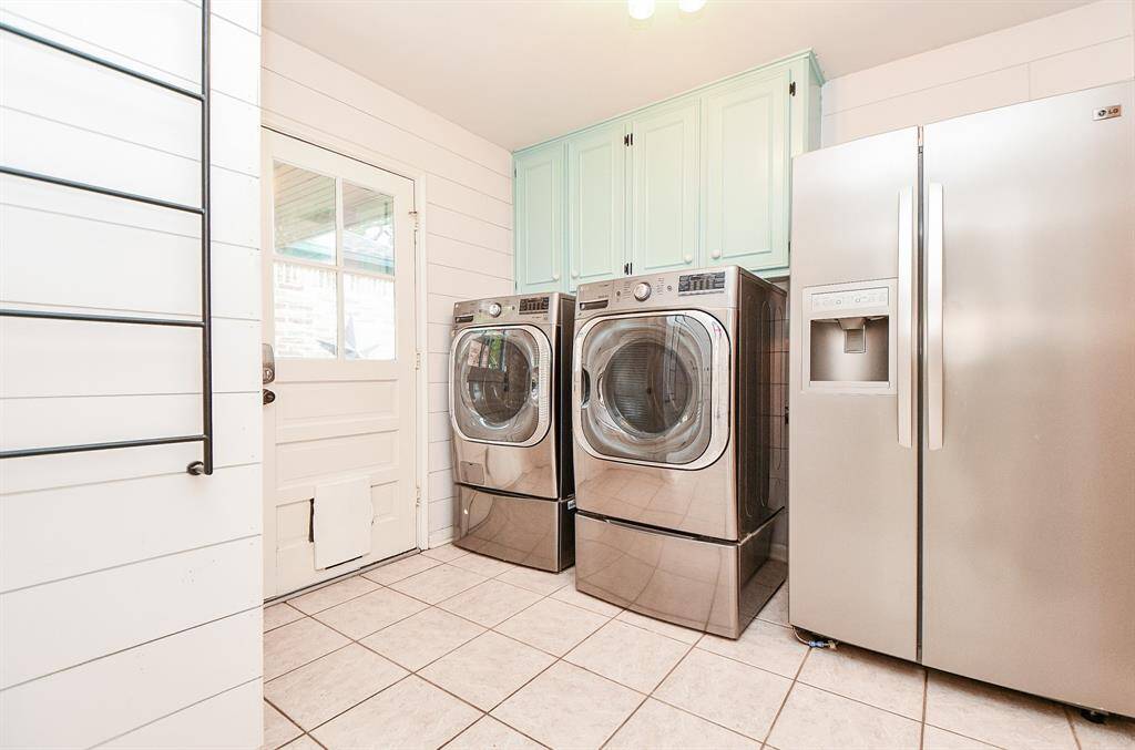 Laundry room is just off the breakfast area.  Door to covered breezeway and 3 car garage