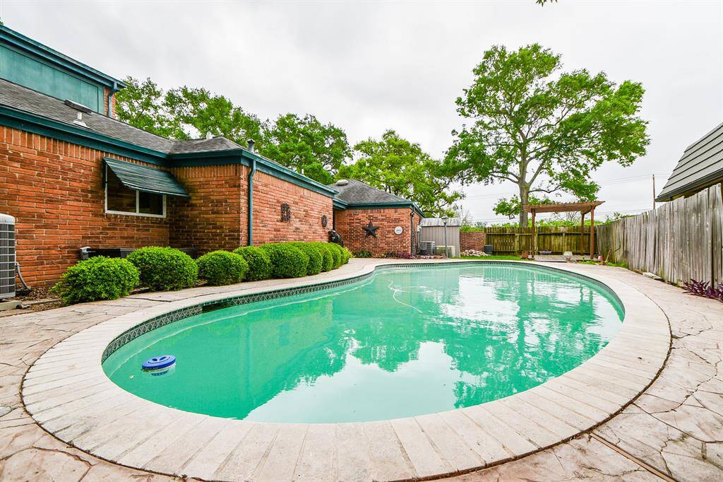 Pool is on side yard and is completely fenced in for safety and privacy