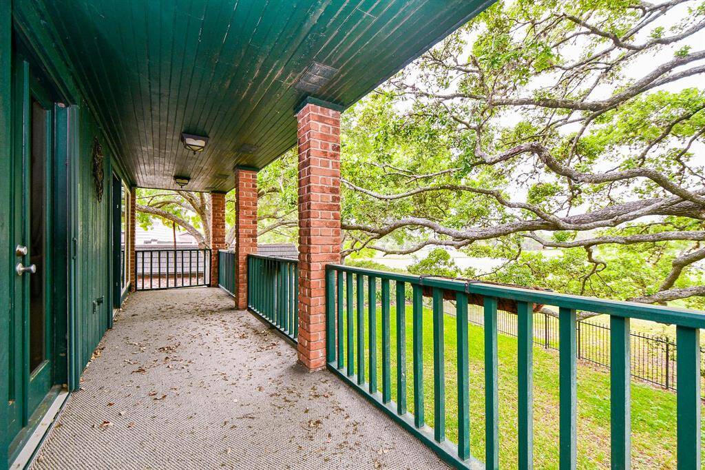 Balcony overlooks the backyard and has golf course and water views