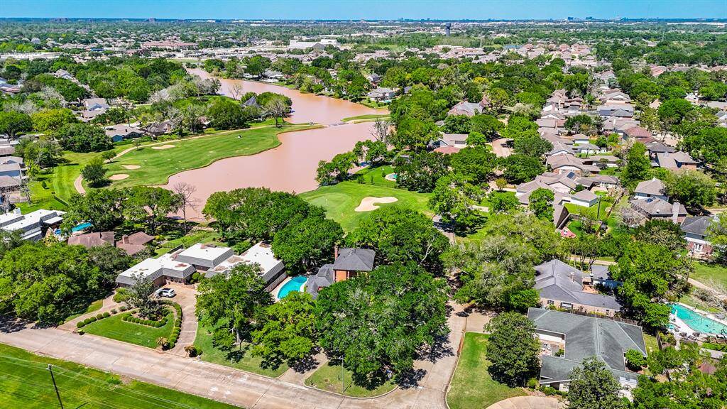Great overhead view of the gorgeous wooded lot with the pool on left side. This view is amazing!