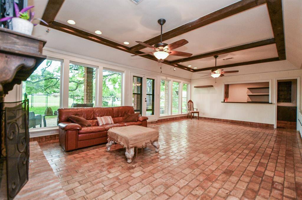 Huge living room with those awesome beams we all love.   Large wet bar in the corner makes for great entertaining