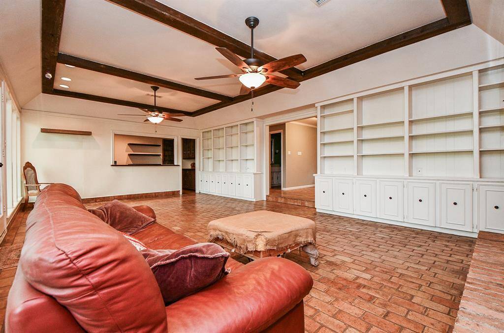 Not 1 but 2 walls of built in cabinets and shelves.   Part of what gives Quail Valley homes so much character