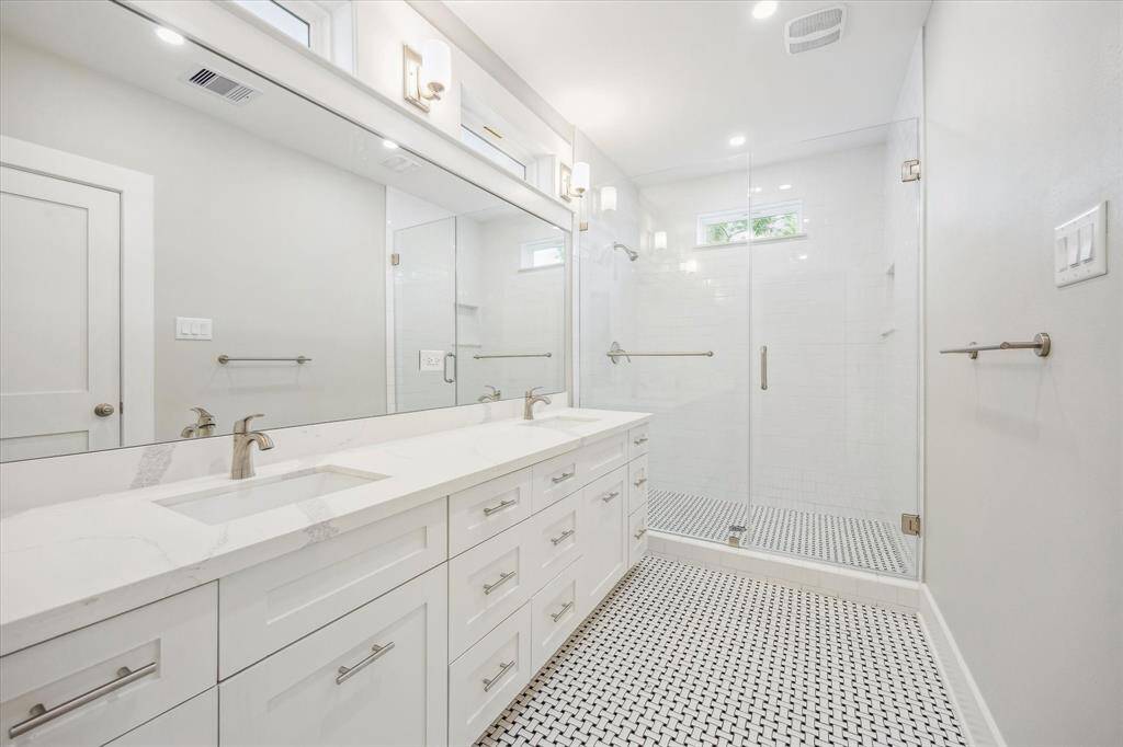 Primary en-suite bath. Extra large shower and long quartz counter with double sinks