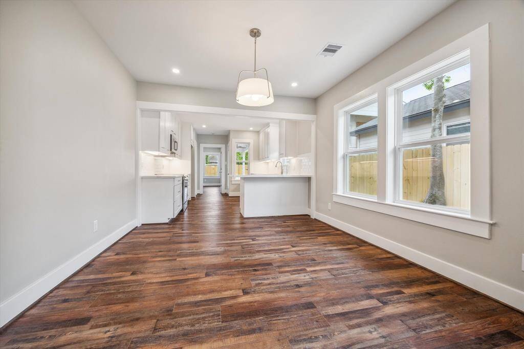 Open concept living, dining, kitchen. Plenty of natural light illuminates this home through all of the new low-e windows