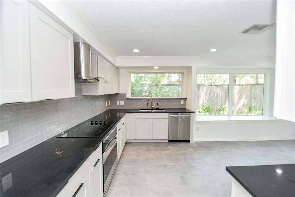 The kitchen is HUGE and has lots of storage space and counter area.  If you want to add a center island, there is plenty of room to do so!