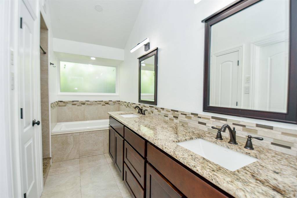 Another view shows the upgraded fixtures & mirrors.