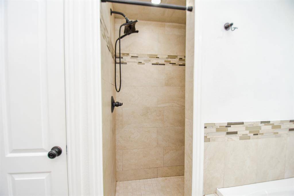The shower is enclosed, so you could even create a steam shower if you wanted to add it.
