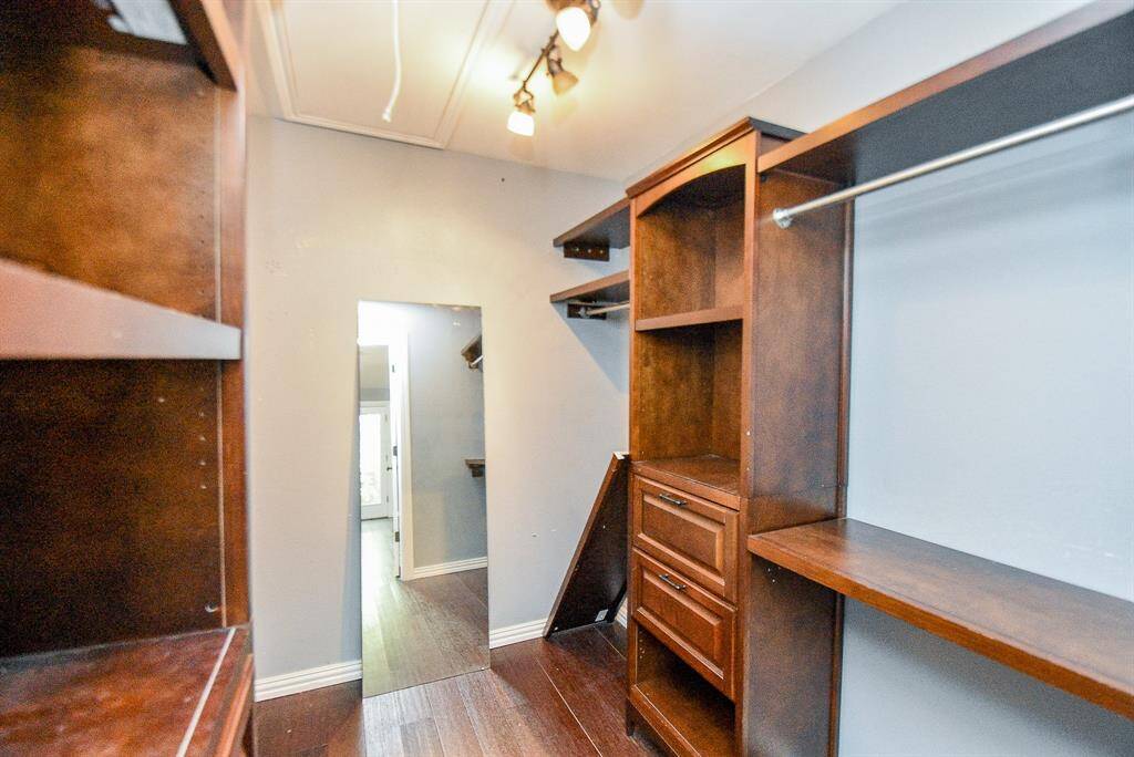 The Primary walk-in closet has lots of custom built ins to help you stay organized.  It is very large, so you may have to go shopping in order to fill this one up - but wait until after Closing.