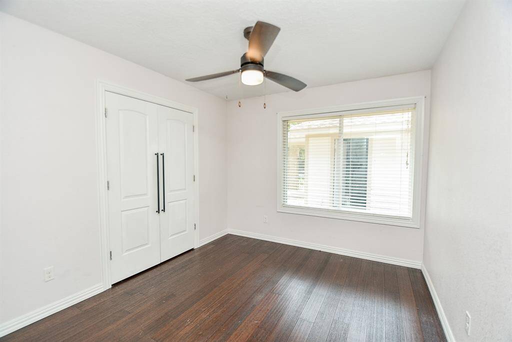 All of the bedrooms also have wood floors and ceiling fans.