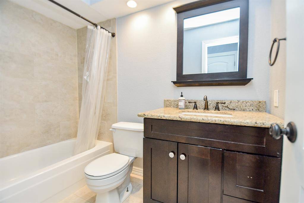 The bathrooms are both updated with granite counters, custom ligting updated vanities, tub surround w/tile and custom mirrors.