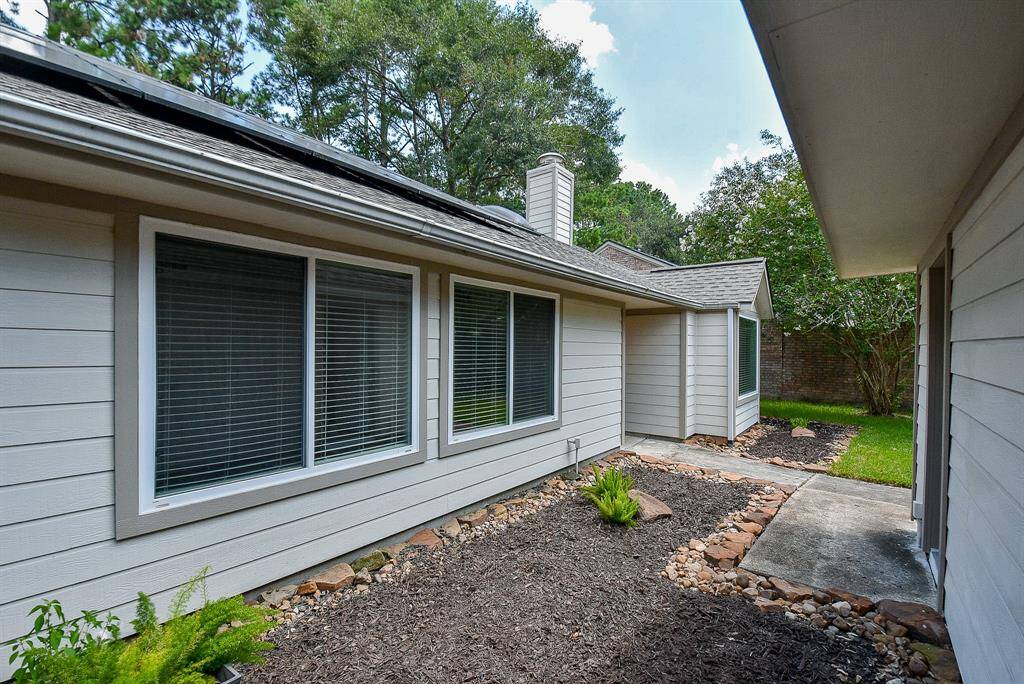 The garage is detached; however, you are secure and behind the gate/fencing.