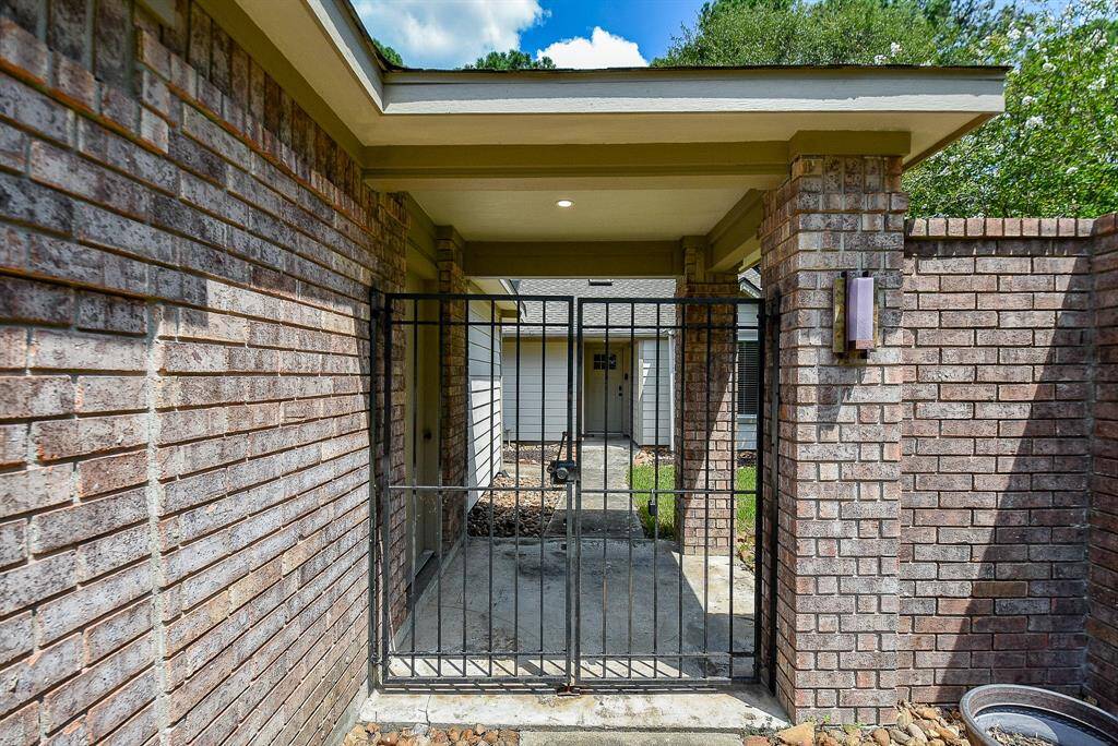 This is the gated entry that leads into the fenced area of the house - this faces the road.