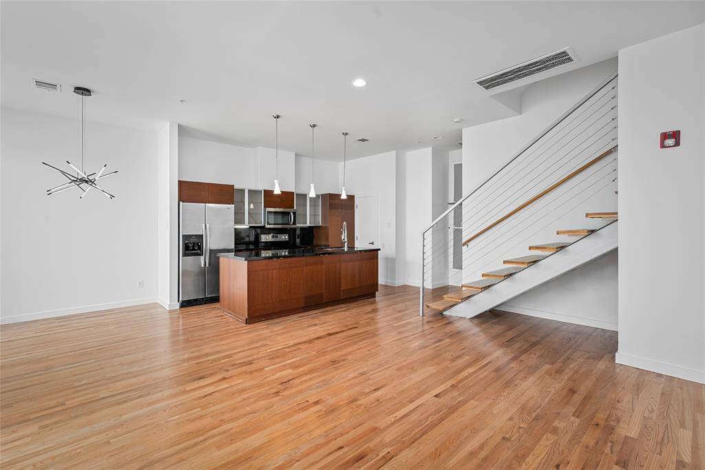 Sleek kitchen with modern fixtures and ample natural light—perfect for your culinary adventures!
