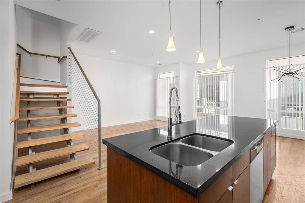 The open concept design keeps you engaged in every corner of the home, allowing you to stay connected to the kitchen, dining, and living areas, perfect for a social and functional flow.