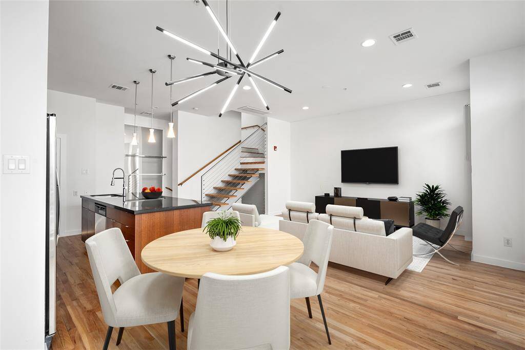 Serene primary bedroom offering ample space for relaxation, featuring large windows that invite natural light and a peaceful atmosphere to unwind after a long day.