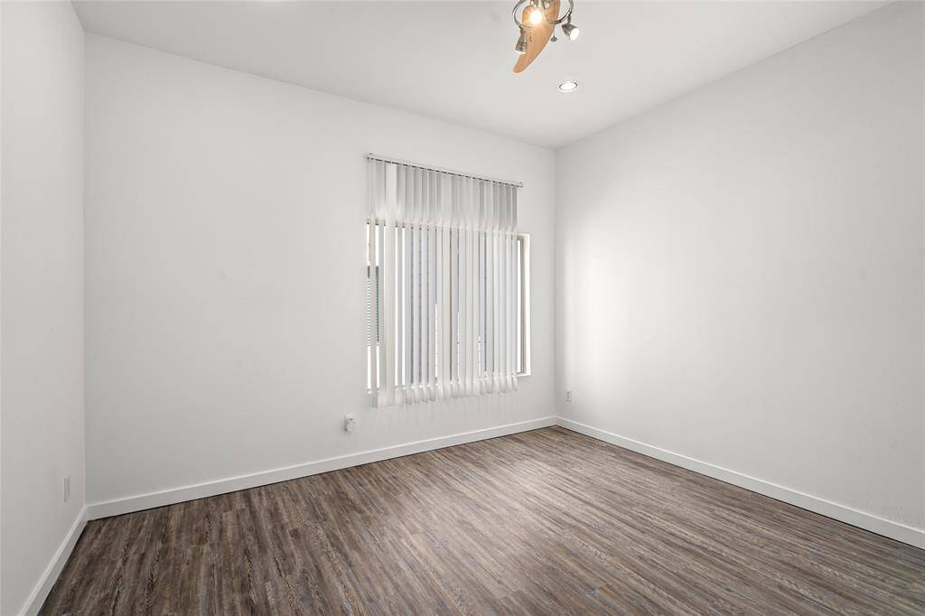 Spacious walk-in closet offering ample storage and organization, perfect for keeping your wardrobe neatly arranged and easily accessible.