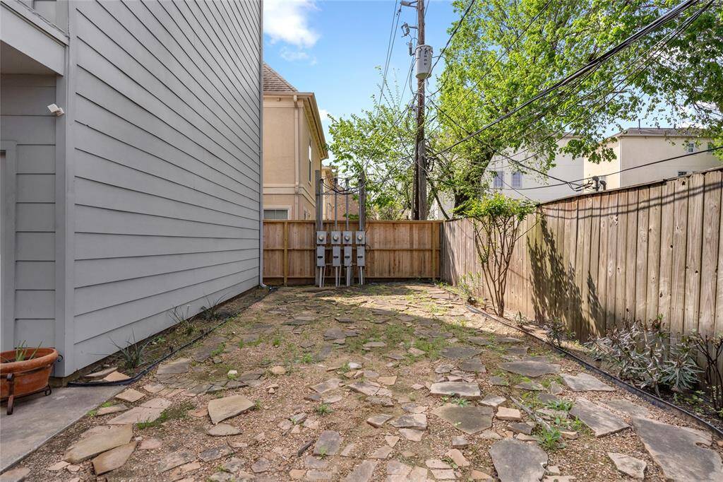 Spacious courtyard offering a private outdoor retreat, perfect for relaxing, entertaining, or enjoying the fresh air in a tranquil setting.