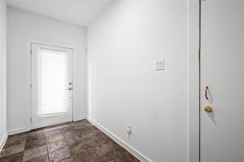 Elegant glass-paneled door that adds a touch of sophistication while allowing natural light to flow inside.