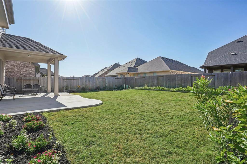Spacious backyard with no two-story neighbors, peak the extended concrete patio