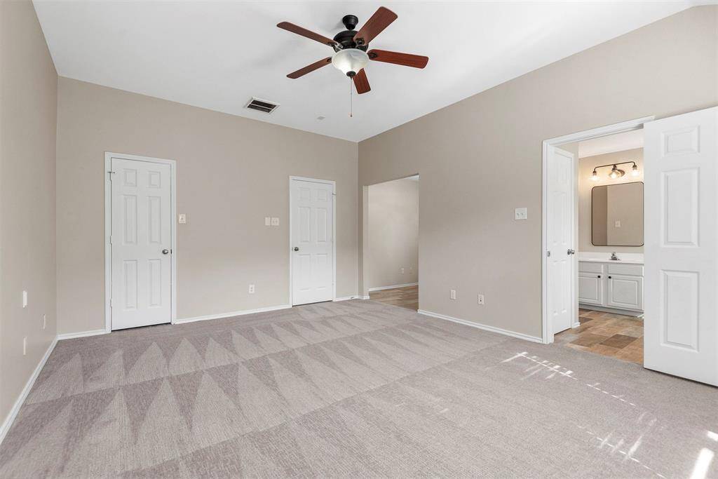 Another view of the primary bedroom