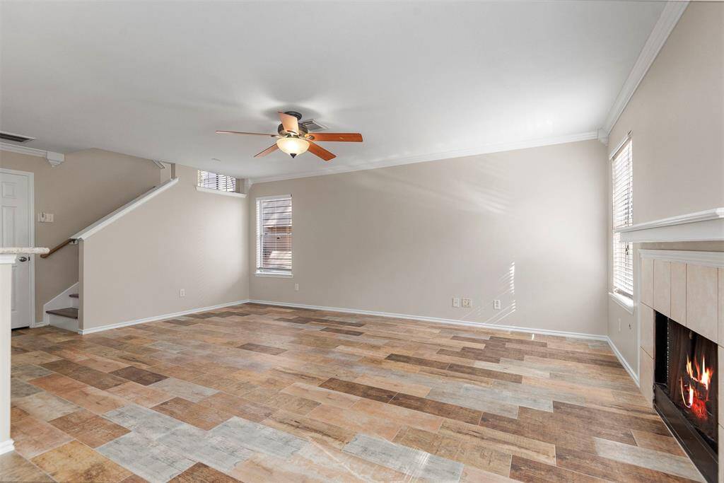 Another view of the living room with half bath by the stairs