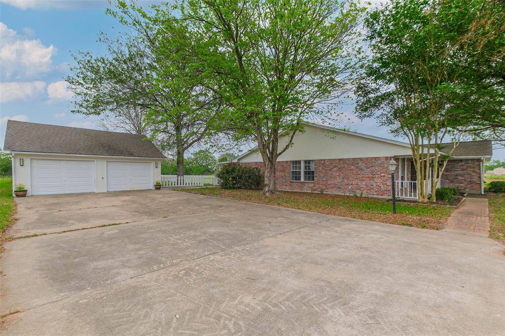 Large driveway in front of garage