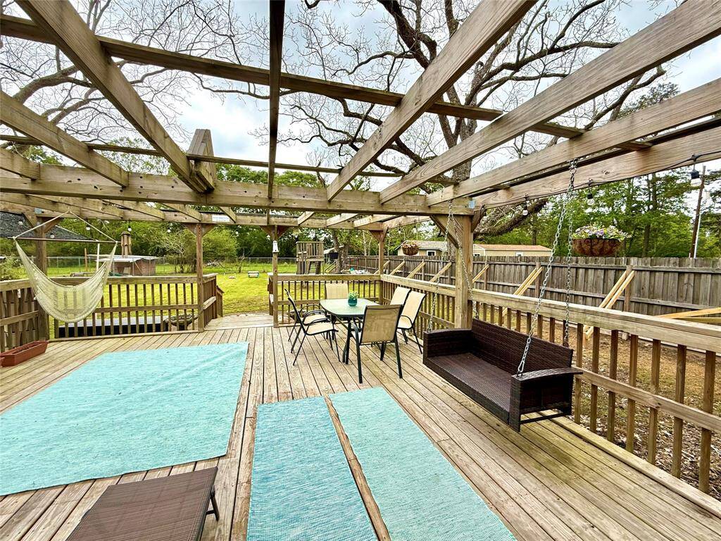 Back porch to the right with view of the play yard