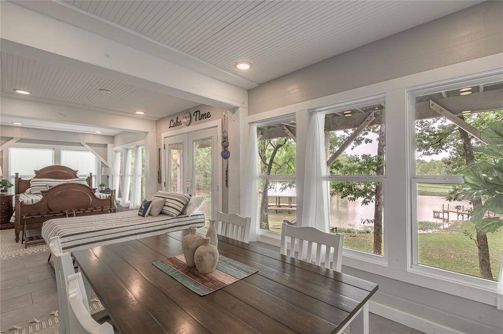Panoramic views of the lake from the large windows in the guest quarters.  All this beautiful furniture will remain with the home.