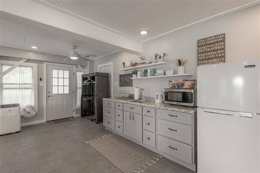 Nice kitchen area and refrigerator that works great for guest and will remain with the home.