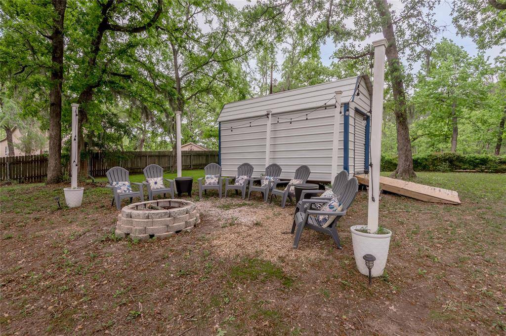 Additional seating, smokeless firepit, and table with coolers.