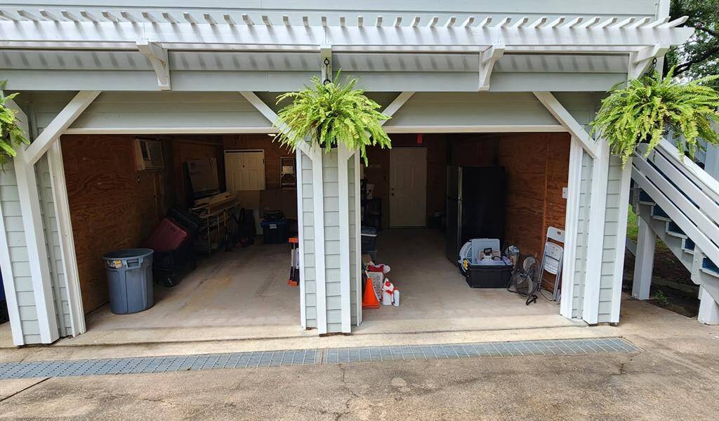 Home has a 2 car garage. The garage on the right has an ADA accessible door leading to the 1st floor guest suite.