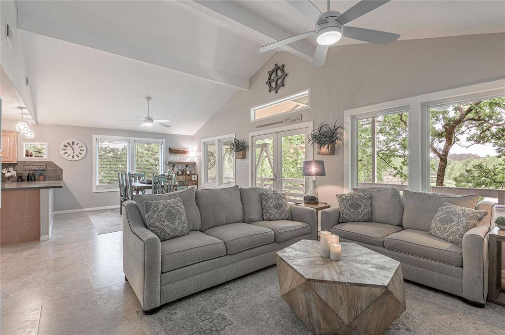 High ceilings with tree top views from every window in the living room and dining room.