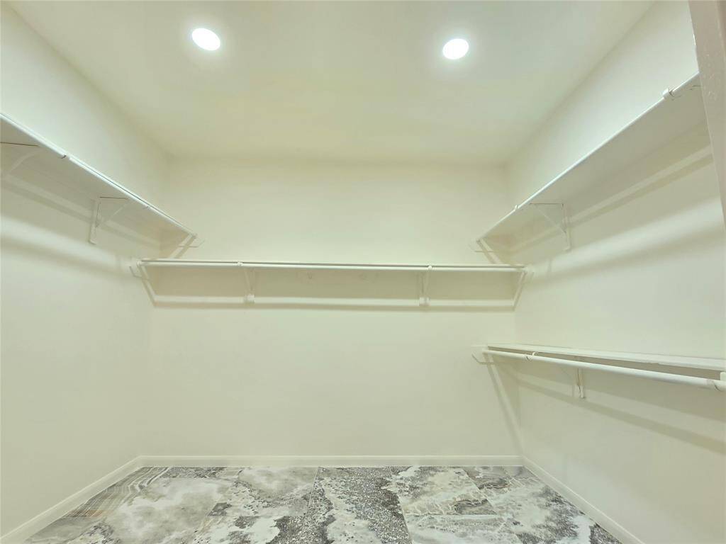 Primary closet with a 10 X 9 dimension